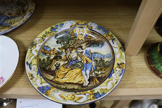 A pair of majolica plates and another